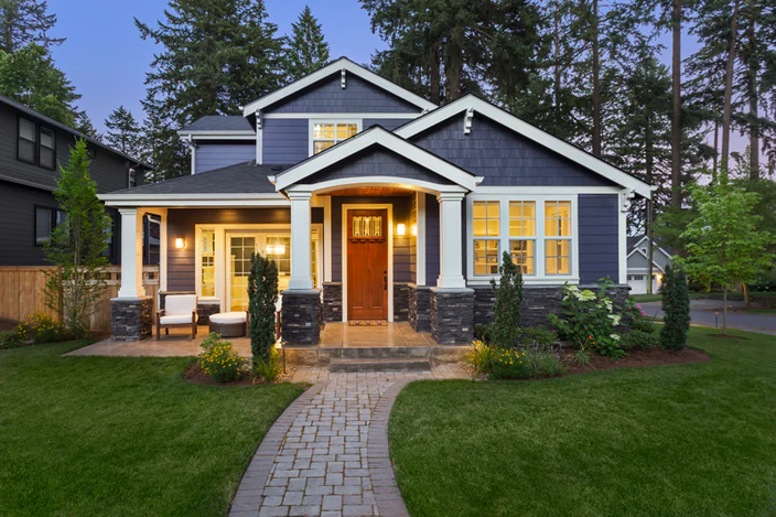 Blue house with lights on