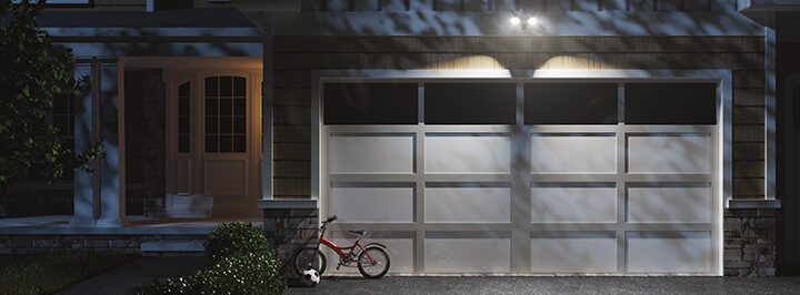 House lit up at night by floodlight camera